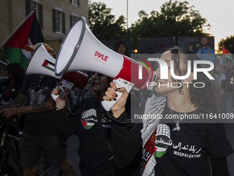 A demonstrator chants during a pro-Palestinian rally as part of an international day of action near the White House in Washington DC, USA, o...