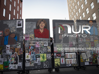 An artwork featuring a picture of Palestinian-American journalist Shireen Abu Akleh and others killed by Israeli soldiers is displayed durin...