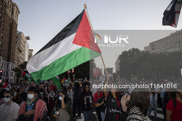 Hundreds gather during a pro-Palestinian rally as part of an international day of action near the White House in Washington DC, USA, on Octo...