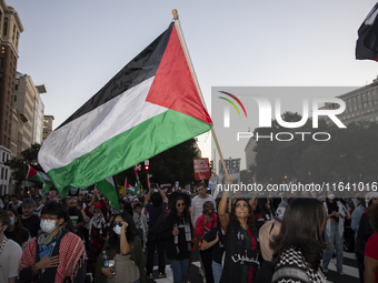 Hundreds gather during a pro-Palestinian rally as part of an international day of action near the White House in Washington DC, USA, on Octo...