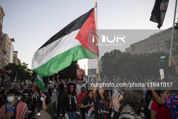 Hundreds gather during a pro-Palestinian rally as part of an international day of action near the White House in Washington DC, USA, on Octo...