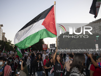 Hundreds gather during a pro-Palestinian rally as part of an international day of action near the White House in Washington DC, USA, on Octo...