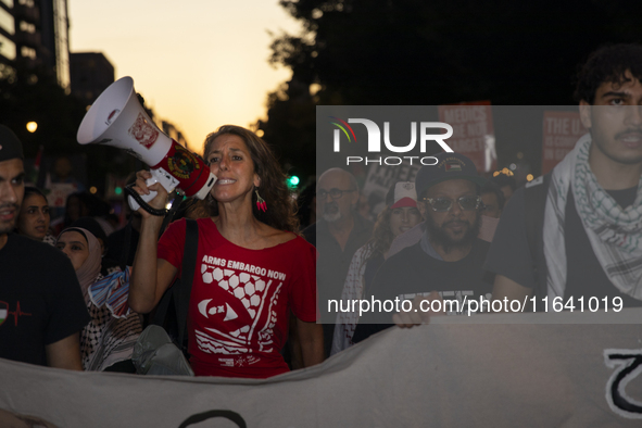 A demonstrator chants during a pro-Palestinian rally as part of an international day of action near the White House in Washington DC, USA, o...