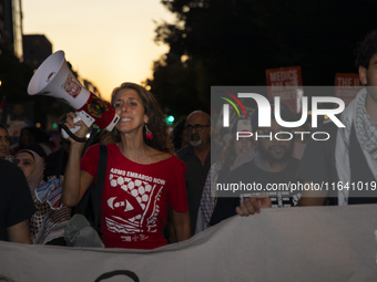 A demonstrator chants during a pro-Palestinian rally as part of an international day of action near the White House in Washington DC, USA, o...