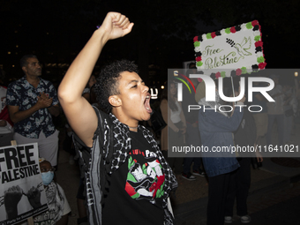 A demonstrator chants during a pro-Palestinian rally as part of an international day of action near the White House in Washington DC, USA, o...