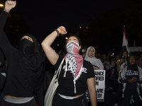 Demonstrators chant during a pro-Palestinian rally as part of an international day of action near the White House in Washington DC, USA, on...