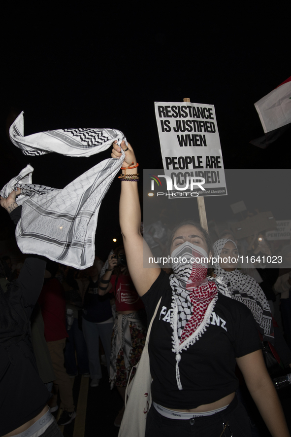 A demonstrator chants during a pro-Palestinian rally as part of an international day of action near the White House in Washington DC, USA, o...