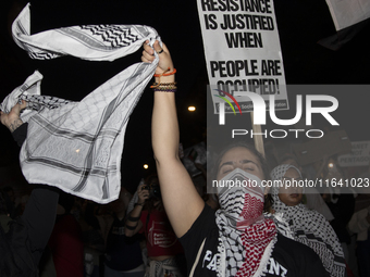 A demonstrator chants during a pro-Palestinian rally as part of an international day of action near the White House in Washington DC, USA, o...