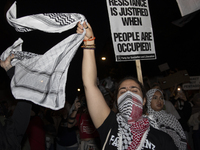 A demonstrator chants during a pro-Palestinian rally as part of an international day of action near the White House in Washington DC, USA, o...