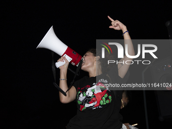 A demonstrator chants during a pro-Palestinian rally as part of an international day of action near the White House in Washington DC, USA, o...