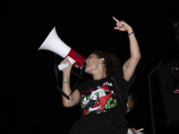 A demonstrator chants during a pro-Palestinian rally as part of an international day of action near the White House in Washington DC, USA, o...