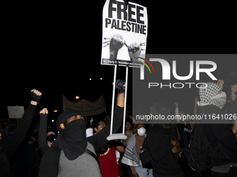 A demonstrator chants during a pro-Palestinian rally as part of an international day of action near the White House in Washington DC, USA, o...