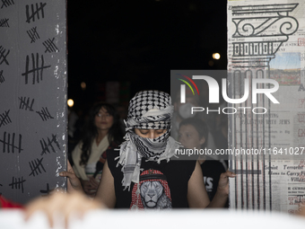 Hundreds gather during a pro-Palestinian rally as part of an international day of action near the White House in Washington DC, USA, on Octo...