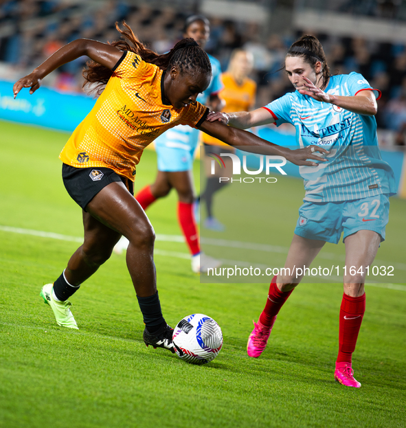 Houston Dash forward Michelle Alozie (11) battles for the ball with Chicago Red Stars midfielder Taylor Malham (32) during a match between H...