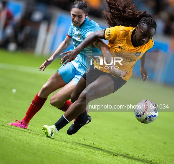 Chicago Red Stars midfielder Taylor Malham (32) and Houston Dash forward Michelle Alozie (11) battle for the ball during a match between Hou...