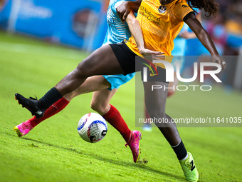 Chicago Red Stars midfielder Taylor Malham (32) and Houston Dash forward Michelle Alozie (11) battle for the ball during a match between Hou...