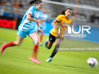 Chicago Red Stars midfielder Taylor Malham (32) and Houston Dash midfielder Barbara Olivieri (15) chase the ball during a match between Hous...