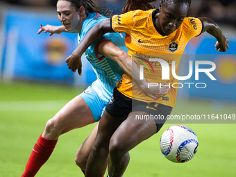 Chicago Red Stars midfielder Taylor Malham (32) and Houston Dash forward Michelle Alozie (11) battle for the ball during a match between Hou...