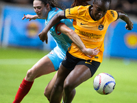 Chicago Red Stars midfielder Taylor Malham (32) and Houston Dash forward Michelle Alozie (11) battle for the ball during a match between Hou...