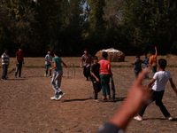 Kashmiri boys celebrate the fall of a wicket during a match in Sopore, Jammu and Kashmir, India, on October 6, 2024. (