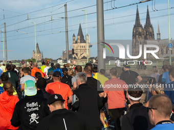 Thousands of people take part in the traditional Cologne Marathon in Cologne, Germany, on October 6, 2024. (