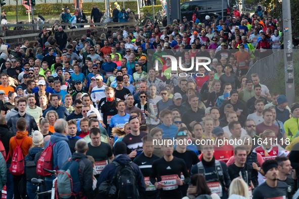 Thousands of people take part in the traditional Cologne Marathon in Cologne, Germany, on October 6, 2024. 