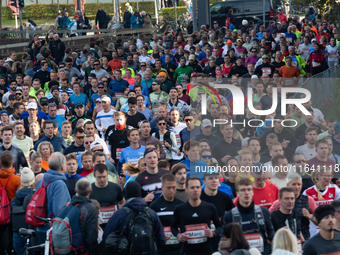 Thousands of people take part in the traditional Cologne Marathon in Cologne, Germany, on October 6, 2024. (