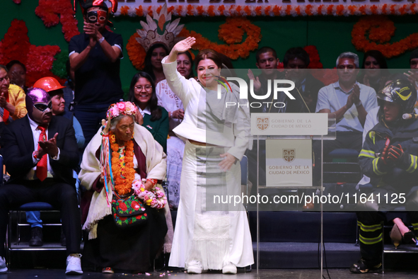 The new Head of Government of Mexico City, Clara Brugada, waves during the celebration ceremony following her inauguration, where she meets...