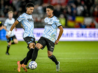 RKC forward Richonell Margaret and RKC midfielder Daouda Weidmann participate in the match between Utrecht and RKC at Stadium de Galgenwaard...