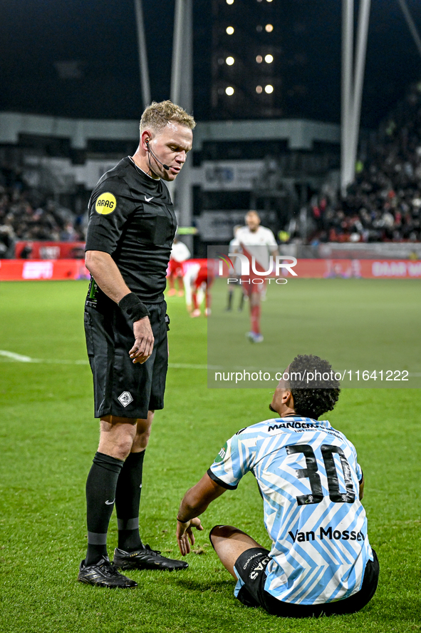 Referee Alex Bos and RKC midfielder Daouda Weidmann are present during the match between Utrecht and RKC at Stadium de Galgenwaard in Utrech...