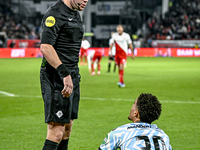 Referee Alex Bos and RKC midfielder Daouda Weidmann are present during the match between Utrecht and RKC at Stadium de Galgenwaard in Utrech...