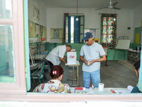 Tunisians cast their votes at a polling station during the presidential election in Ariana, a suburb of Tunis, Tunisia, on October 6, 2024....