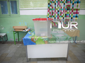 An almost empty ballot box is seen in a polling station during the presidential election in Ariana, a suburb of Tunis, Tunisia, on October 6...