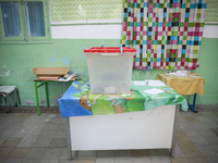 An almost empty ballot box is seen in a polling station during the presidential election in Ariana, a suburb of Tunis, Tunisia, on October 6...