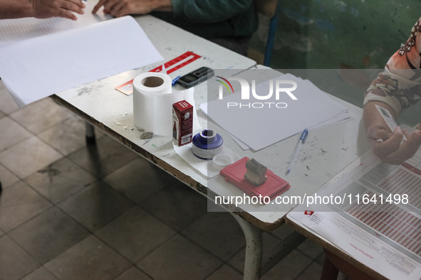 A bottle of indelible ink for election purposes is seen at a polling station during the presidential election in Ariana, a suburb of Tunis,...