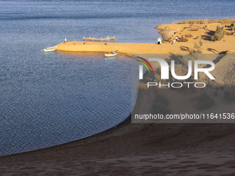 The Magic Lake is a lake located in Wadi El Hitan in Fayoum. It overlooks sand dunes and provides the opportunity to witness sunsets. The la...