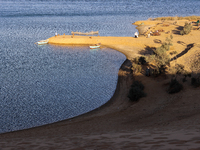 The Magic Lake is a lake located in Wadi El Hitan in Fayoum. It overlooks sand dunes and provides the opportunity to witness sunsets. The la...