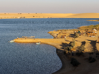 The Magic Lake is a lake located in Wadi El Hitan in Fayoum. It overlooks sand dunes and provides the opportunity to witness sunsets. The la...