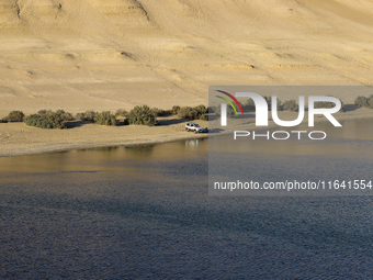 The Magic Lake is a lake located in Wadi El Hitan in Fayoum. It overlooks sand dunes and provides the opportunity to witness sunsets. The la...