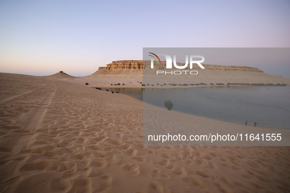 The Magic Lake is a lake located in Wadi El Hitan in Fayoum. It overlooks sand dunes and provides the opportunity to witness sunsets. The la...