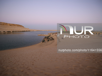 The Magic Lake is a lake located in Wadi El Hitan in Fayoum. It overlooks sand dunes and provides the opportunity to witness sunsets. The la...