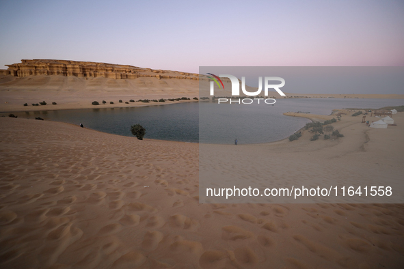 The Magic Lake is a lake located in Wadi El Hitan in Fayoum. It overlooks sand dunes and provides the opportunity to witness sunsets. The la...