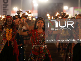 Participants perform 'Garba' during the Dainik Bhaskar Abhivyakti 'Garba Mahotsav' on the occasion of the 'Navratri festival' in Jaipur, Raj...