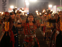 Participants perform 'Garba' during the Dainik Bhaskar Abhivyakti 'Garba Mahotsav' on the occasion of the 'Navratri festival' in Jaipur, Raj...