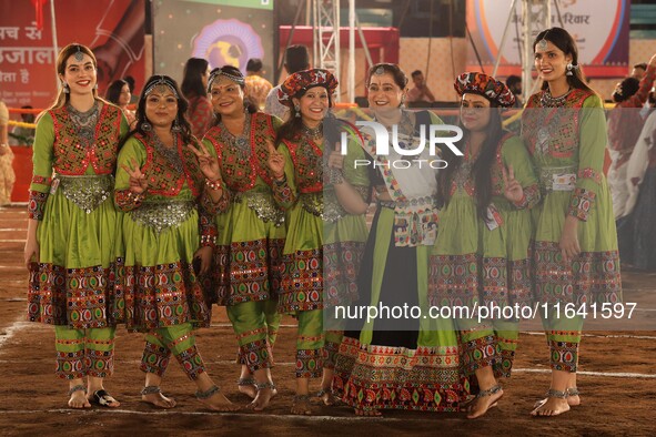 Participants perform 'Garba' during the Dainik Bhaskar Abhivyakti 'Garba Mahotsav' on the occasion of the 'Navratri festival' in Jaipur, Raj...