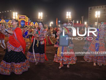 Participants perform 'Garba' during the Dainik Bhaskar Abhivyakti 'Garba Mahotsav' on the occasion of the 'Navratri festival' in Jaipur, Raj...