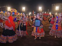 Participants perform 'Garba' during the Dainik Bhaskar Abhivyakti 'Garba Mahotsav' on the occasion of the 'Navratri festival' in Jaipur, Raj...