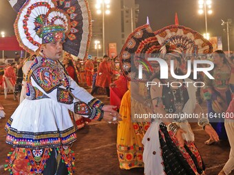 Participants perform 'Garba' during the Dainik Bhaskar Abhivyakti 'Garba Mahotsav' on the occasion of the 'Navratri festival' in Jaipur, Raj...