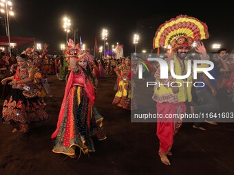 Participants perform 'Garba' during the Dainik Bhaskar Abhivyakti 'Garba Mahotsav' on the occasion of the 'Navratri festival' in Jaipur, Raj...