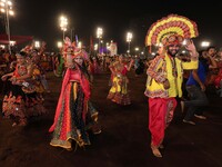 Participants perform 'Garba' during the Dainik Bhaskar Abhivyakti 'Garba Mahotsav' on the occasion of the 'Navratri festival' in Jaipur, Raj...